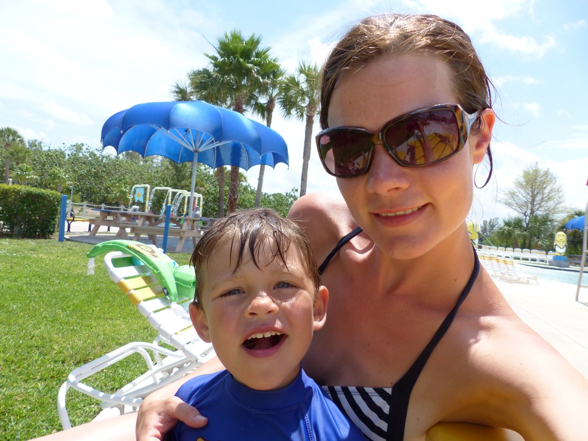 Line and Noah selfie at the water park — sunglasses, smiles, and three weeks of camping happiness
