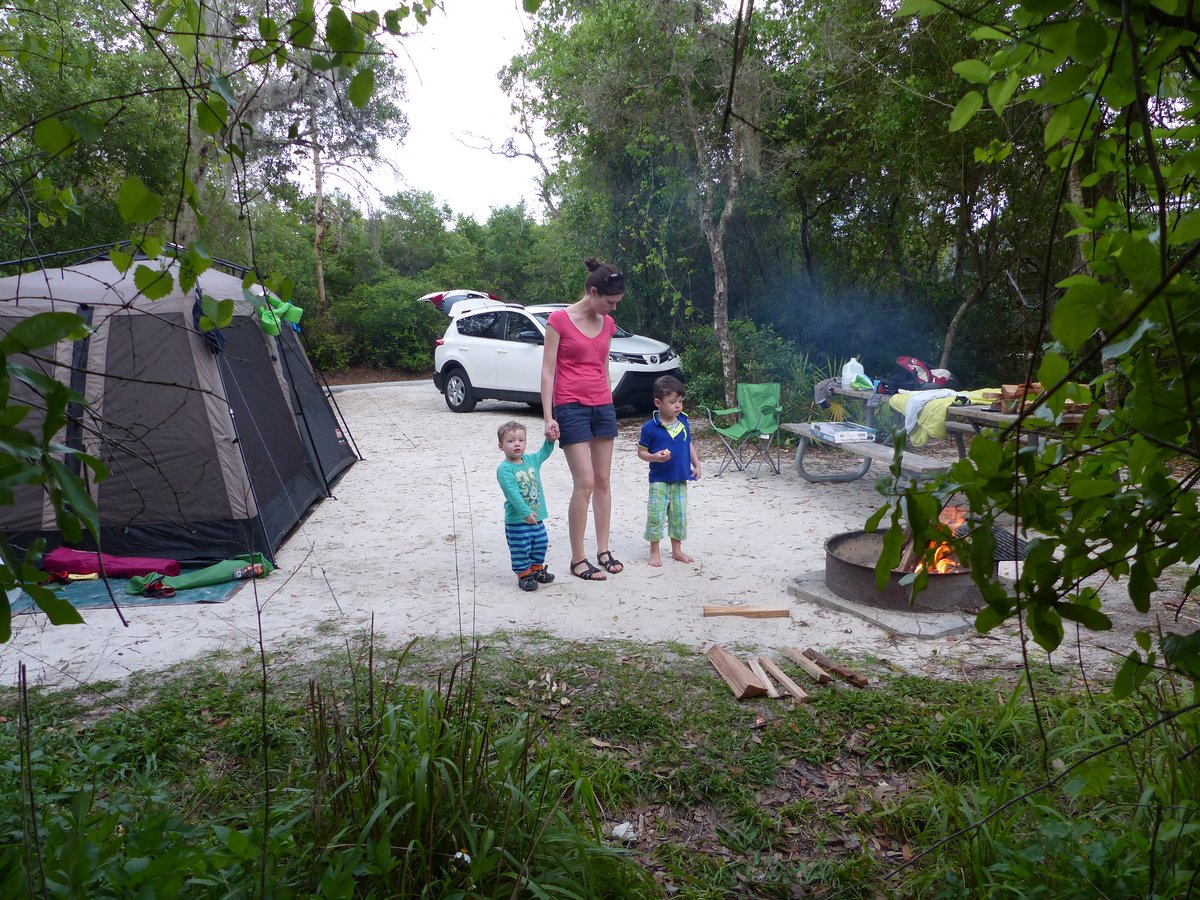The campsite — tent, car, campfire smoking, and Line with both boys