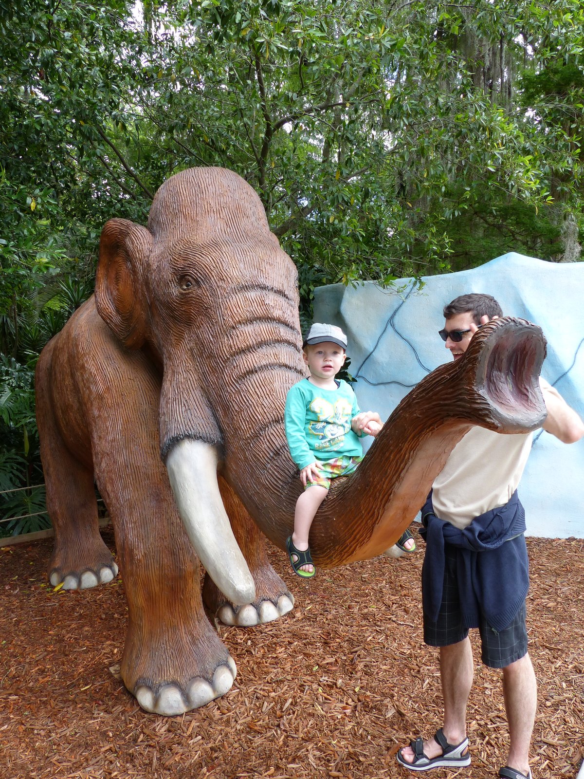 Noah on the river boat cruise — baseball cap, ice cream, and a satisfied grin
