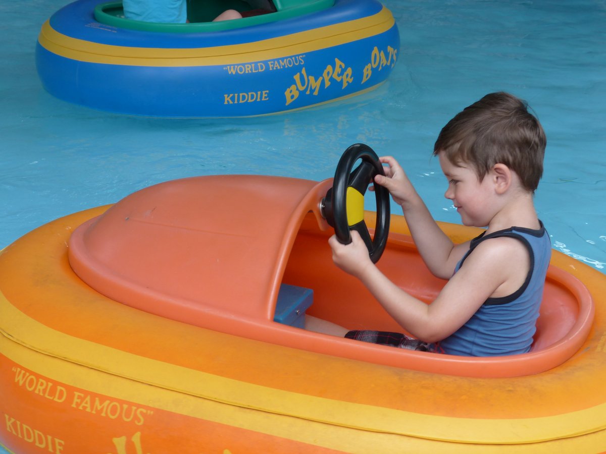 Kids digging for fossils in the sand pit at Dinosaur World — Noah excavating, Vitus sampling the terrain