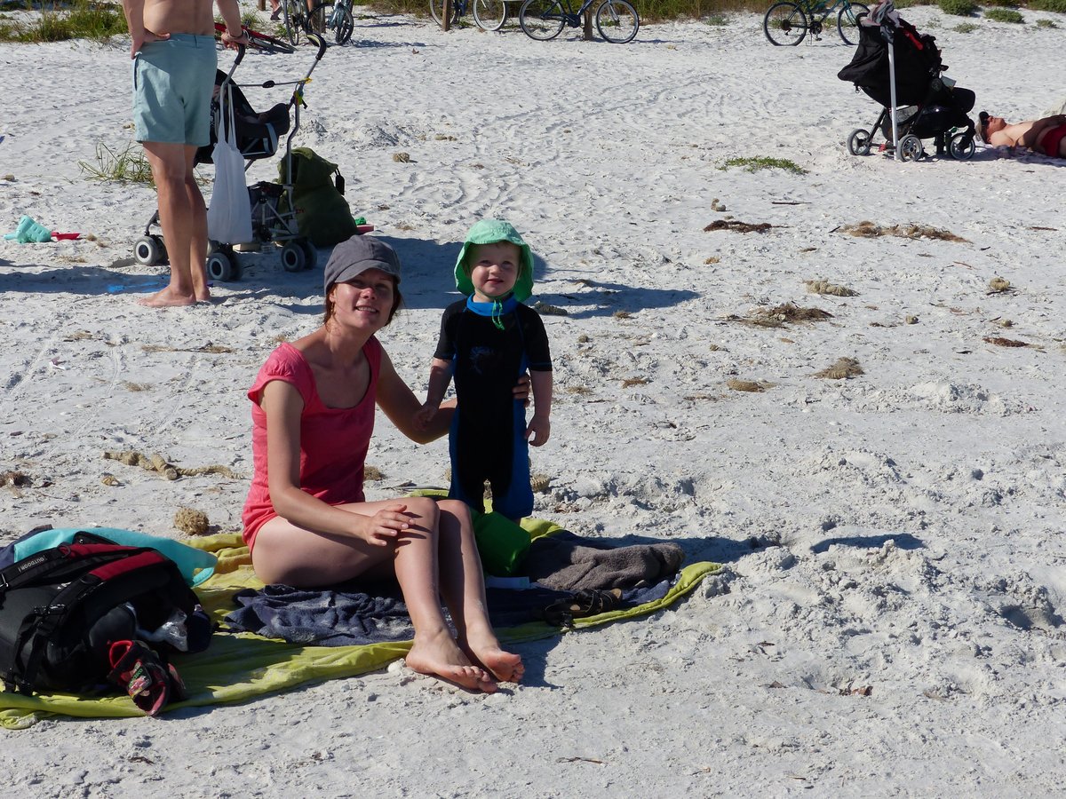 Line with the boys on the white sand Gulf Coast beach — the moment we fell in love with Florida