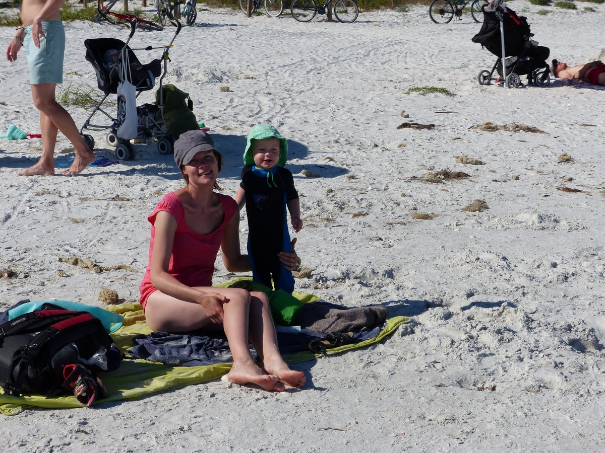Line and Vitus sitting on the impossibly white Gulf sand