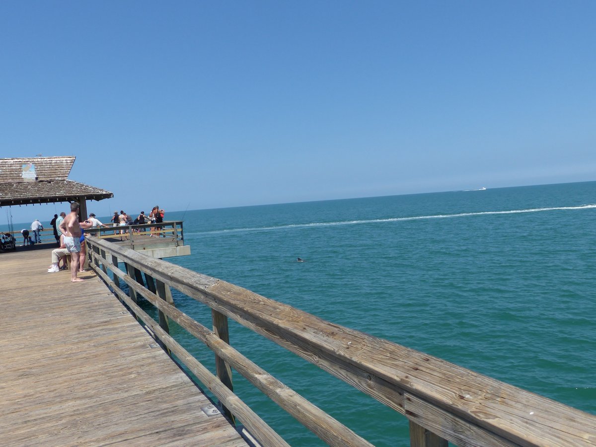 Naples Pier stretching into the turquoise Gulf of Mexico — postcard perfect