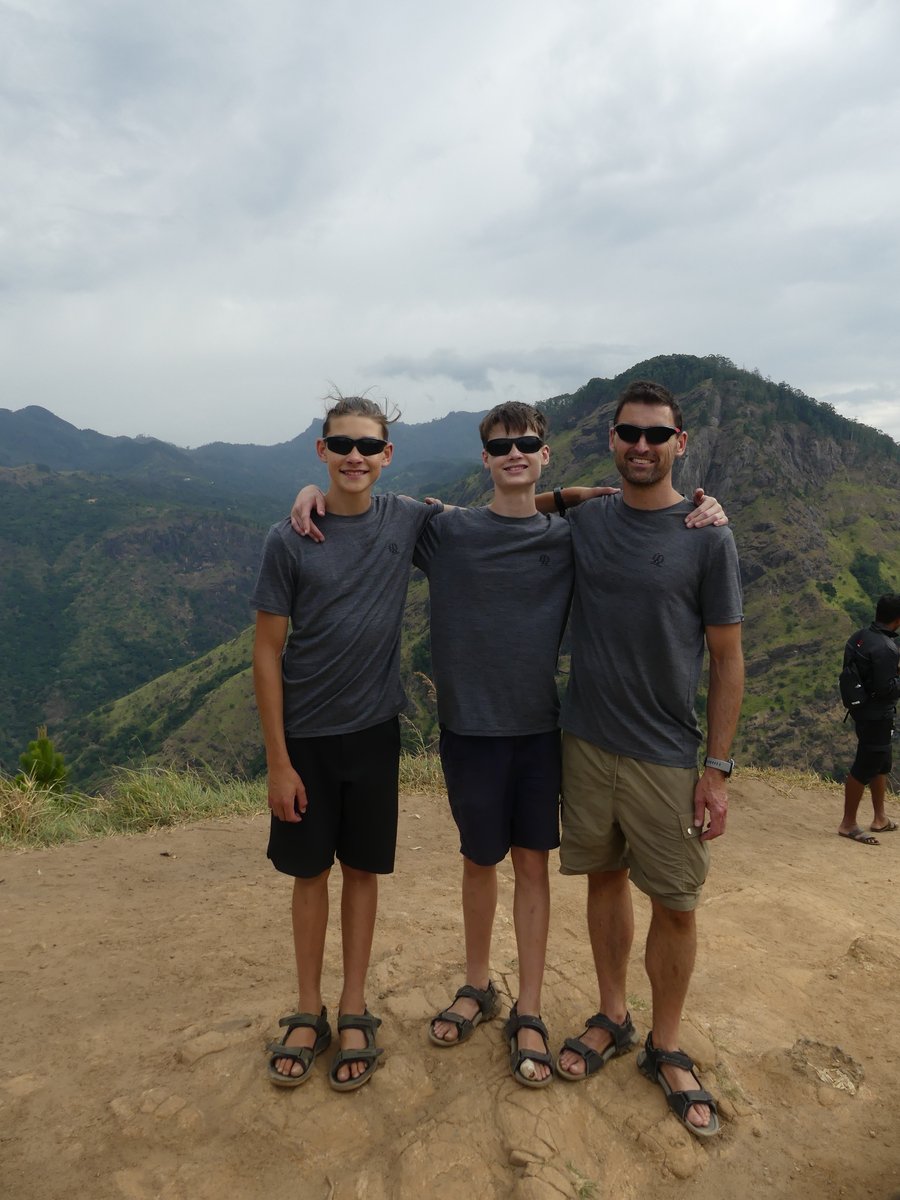 Vitus, Noah and Jesper arm in arm at the top of Little Adam's Peak