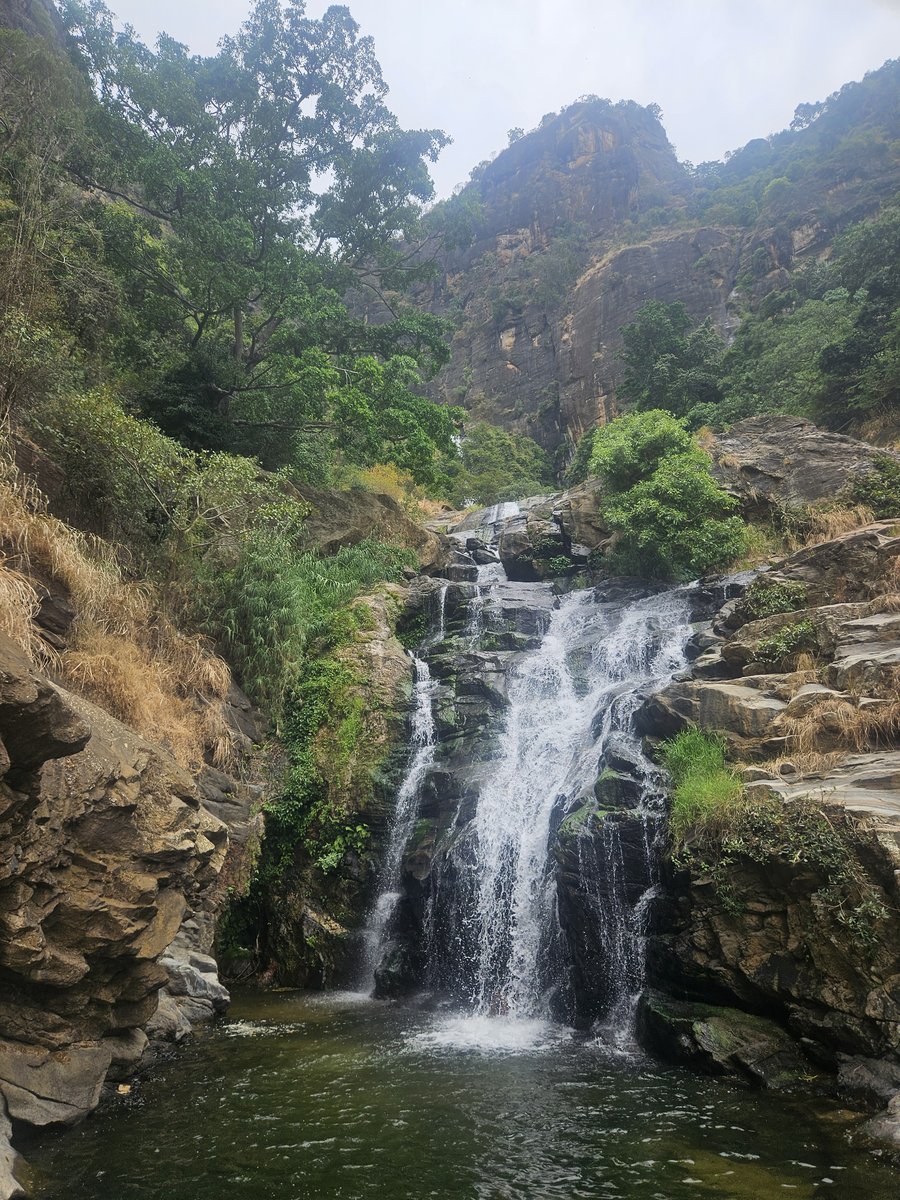 Ravana Falls tumbling down a rock face into a pool near Ella