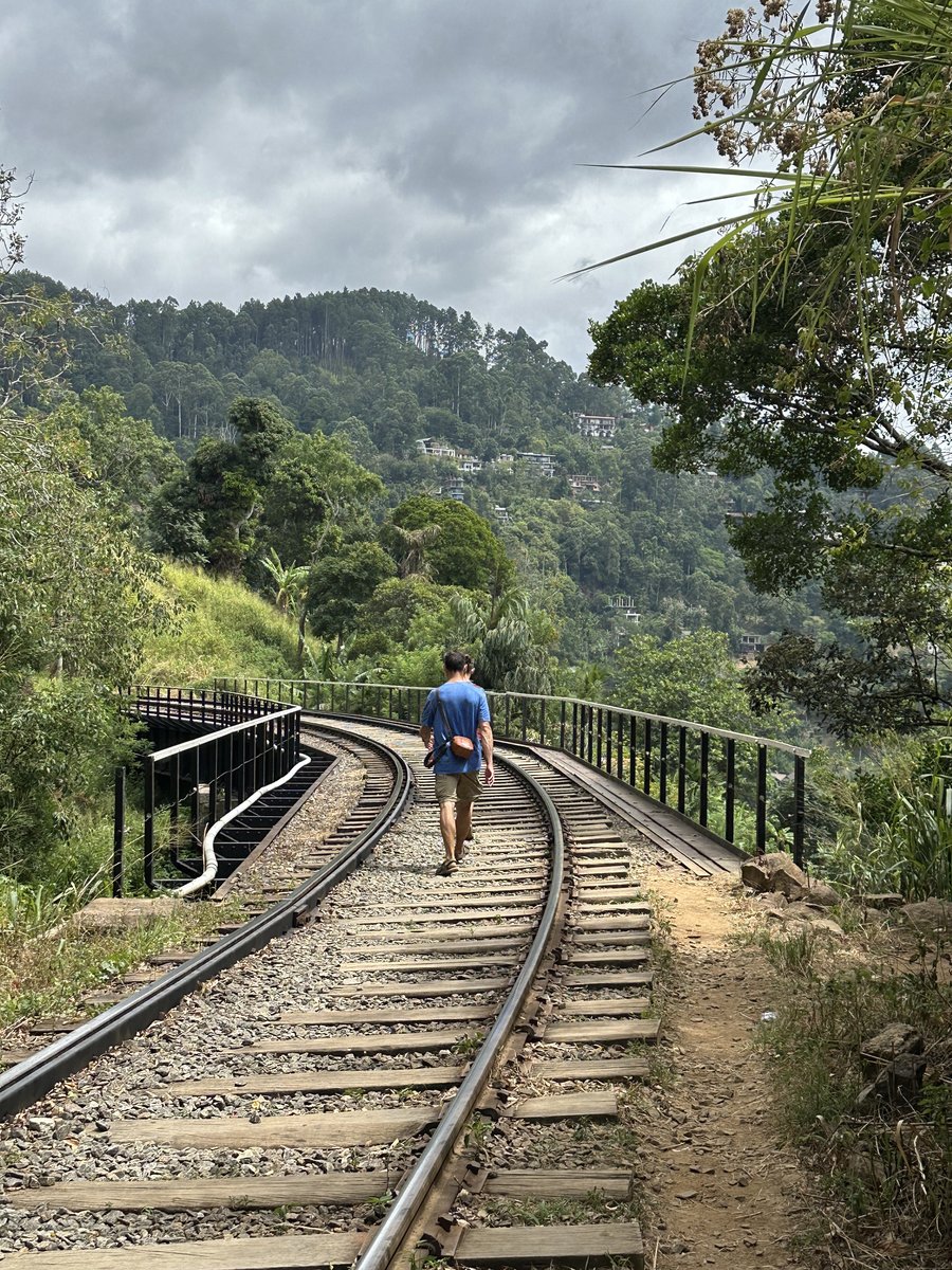 Jesper walking along the railway line on the way to Ella Rock, disc in hand