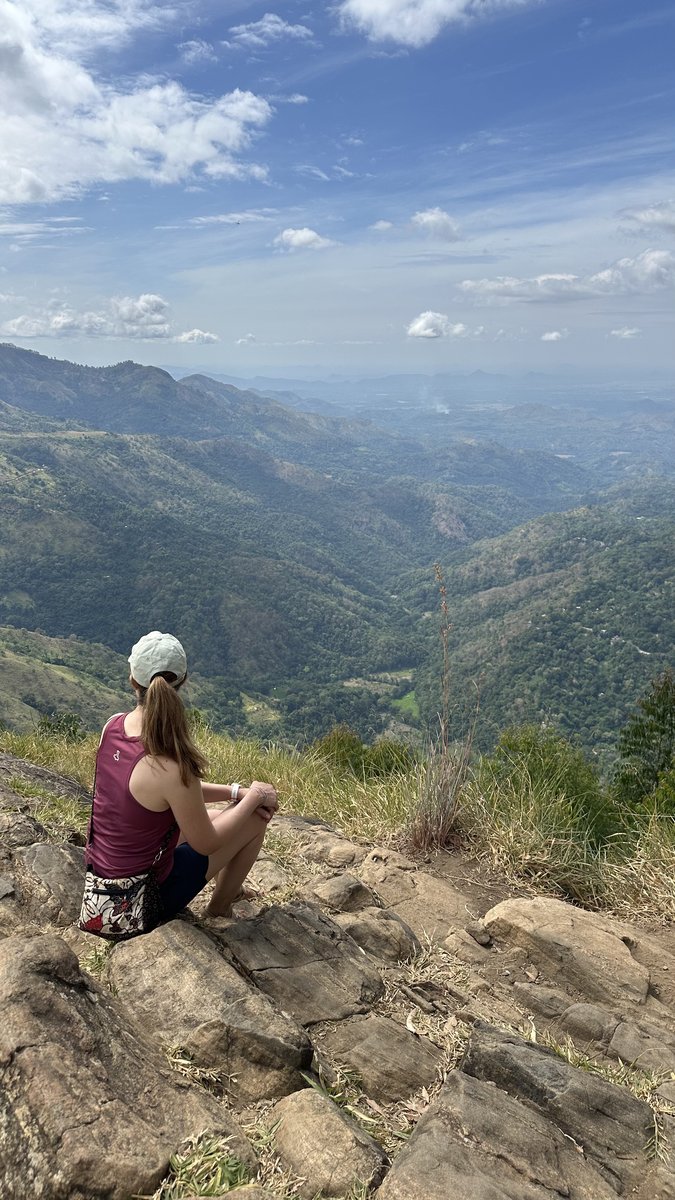 Line sitting on the rocks at the Ella Rock summit taking in the valley view
