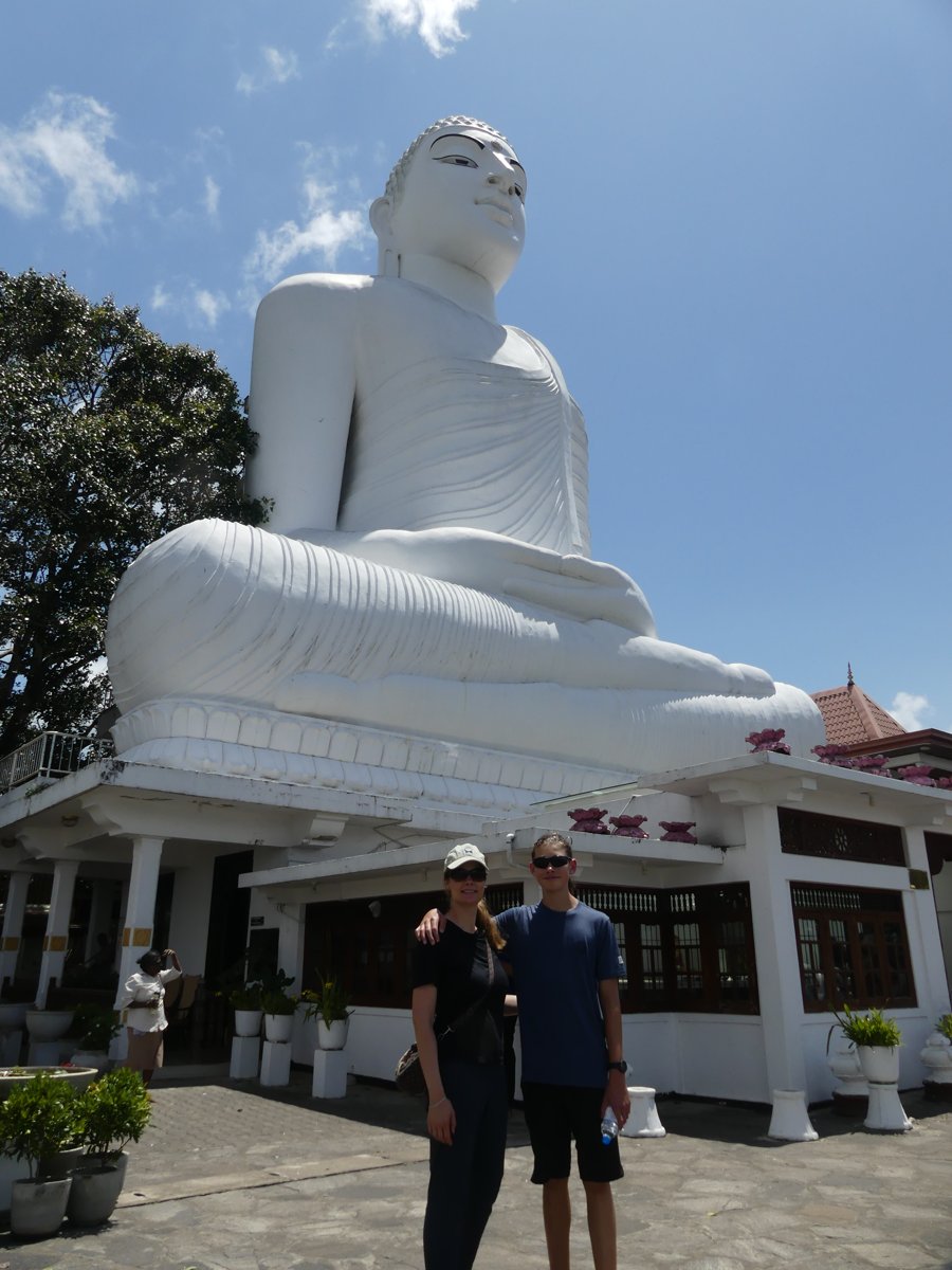 Line and Vitus at the base of the towering giant white Buddha above Kandy