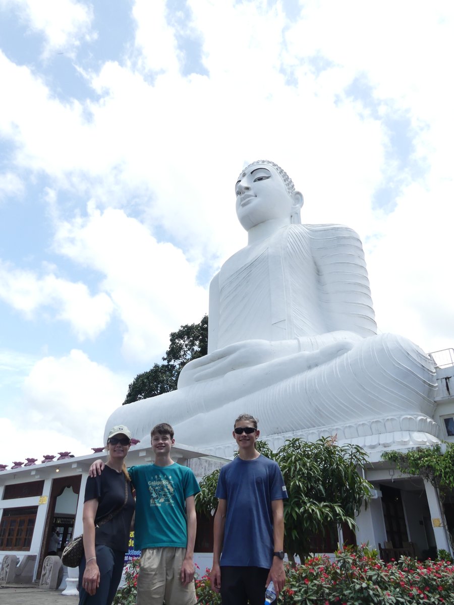 Line, Vitus and Noah at the foot of the giant white Buddha
