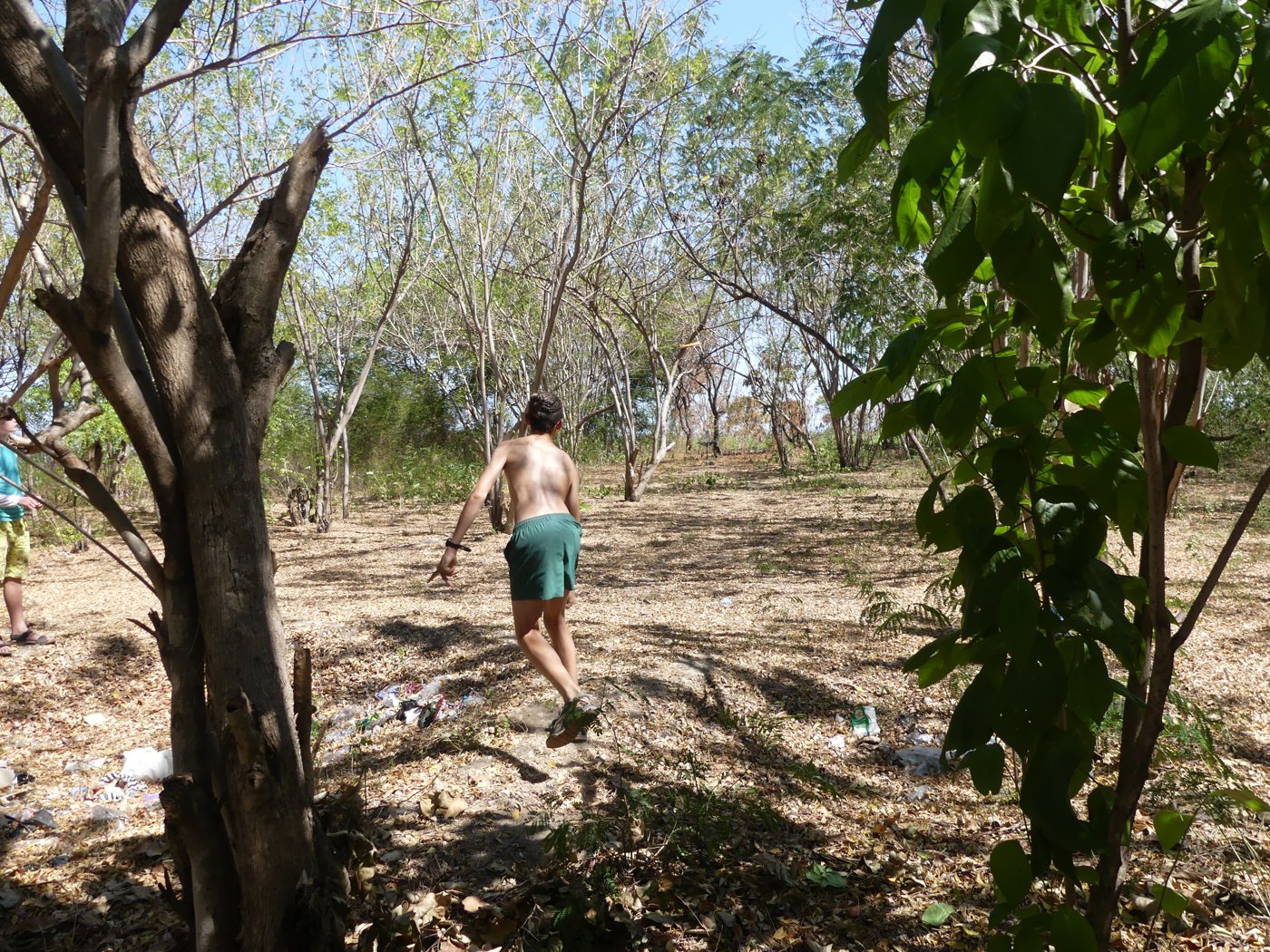 Playing disc golf among the trees on one of the islands