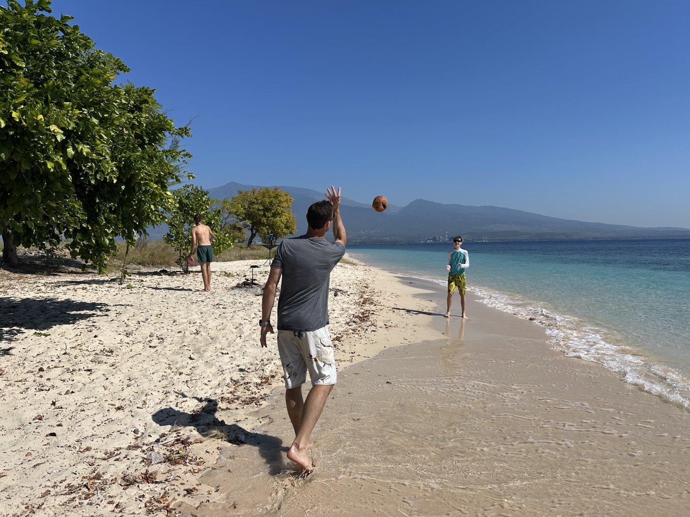 The family walking the sandbar between islands