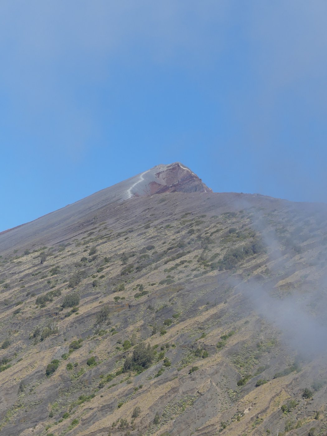 The crater rim with cloud drifting across