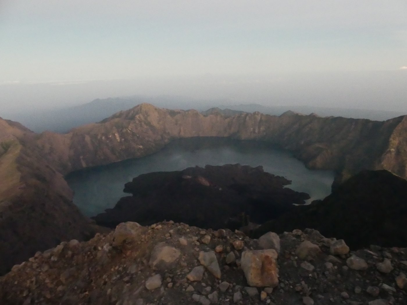 The crater rim and lake glowing in the first light