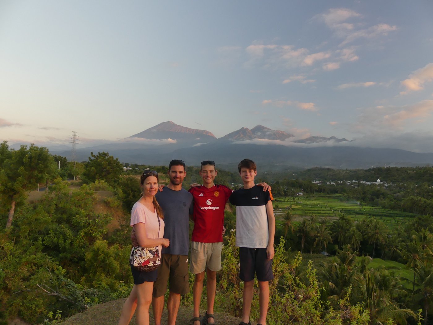 The family at the sunset viewpoint with the volcano behind