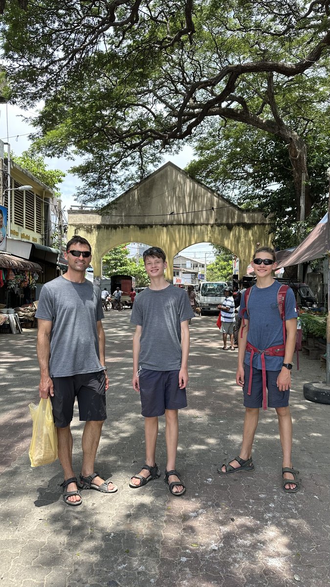Jesper, Noah and Vitus in front of an old archway gate in Negombo town