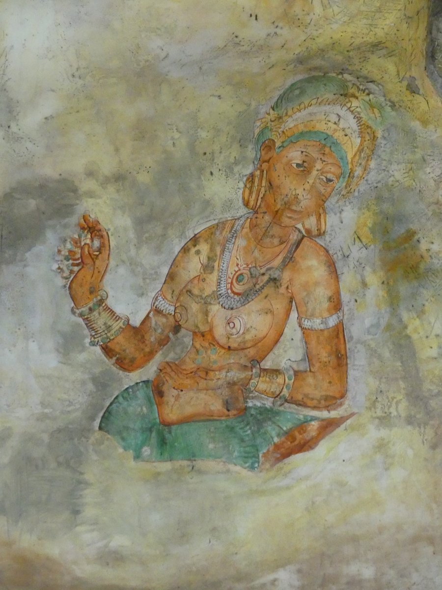 One of the Sigiriya frescoes — a Sigiriya Maiden painted on the rock face