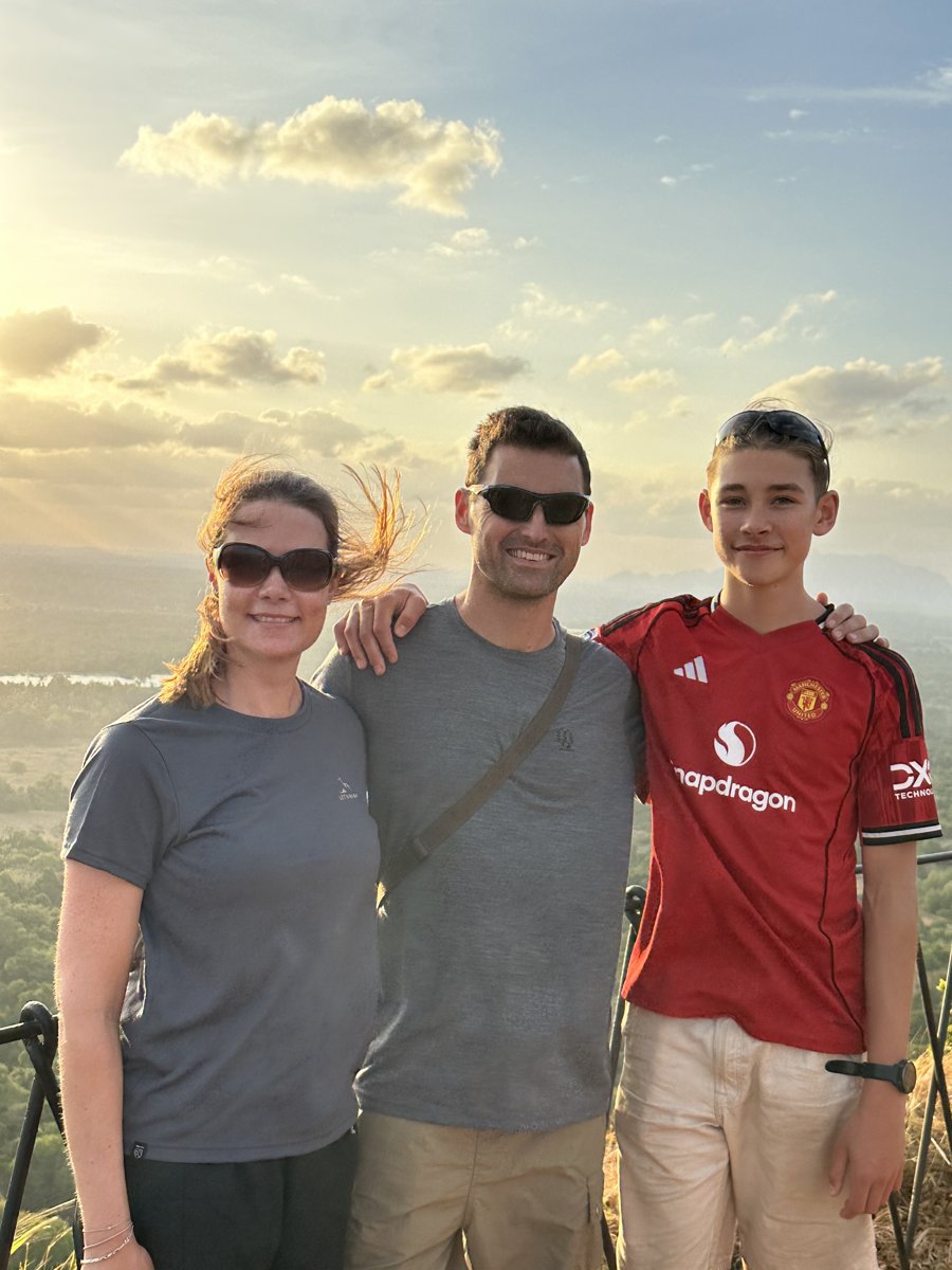 Line, Jesper and Noah together at the Sigiriya summit in golden late-afternoon light